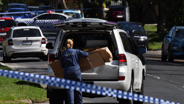Forensic police take away evidence after a woman was found dead in her home in Heidelberg West.