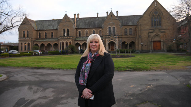 Principal Filina Virgato in front of Presentation College