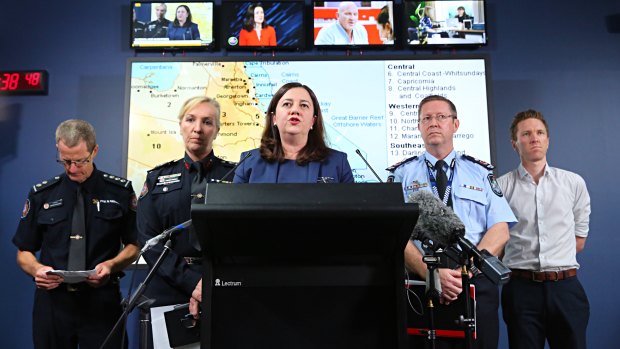 QFES predictive services inspector Andrew Sturgess, Fire Commissioner Katarina Carroll, Queensland Premier Annastacia Palaszczuk, State Disaster Coordinator Bob Gee and Bureau of Meteorology senior forecaster David Grant at the Kedron Emergency Services Centre.