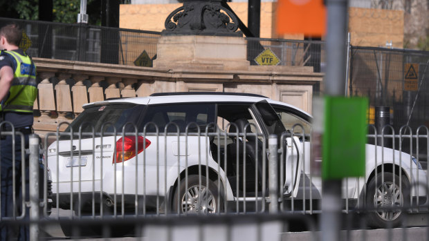 The station wagon remains outside Parliament House in Spring Street.