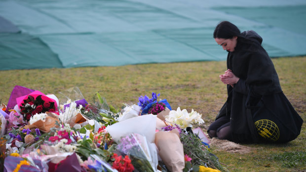 A woman pays her respects.