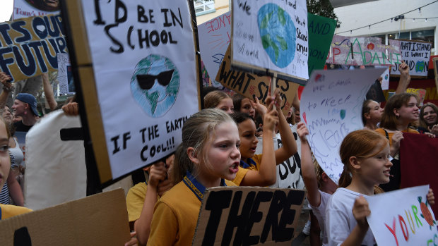 School children at a climate change protest near the office of Tony Abbott in Manly.