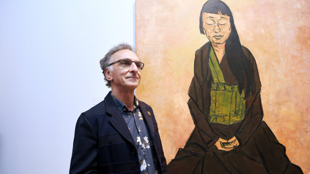 Tony Costa with his portrait of artist Lindy Lee.