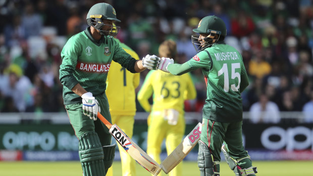 Bangladesh's Mushfiqur Rahim, right, and teammate Mahmudullah congratulate each other.