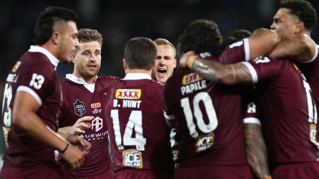 Daly Cherry-Evans and the Maroons celebrate after Cam Munster's decisive try.