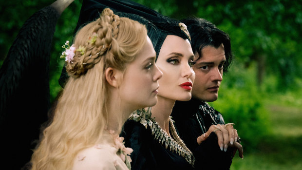 Keeping it in the family: Elle Fanning as Aurora, Angelina Jolie as Maleficent and Sam Riley as the raven Diaval in Maleficent: Mistress of Evil.