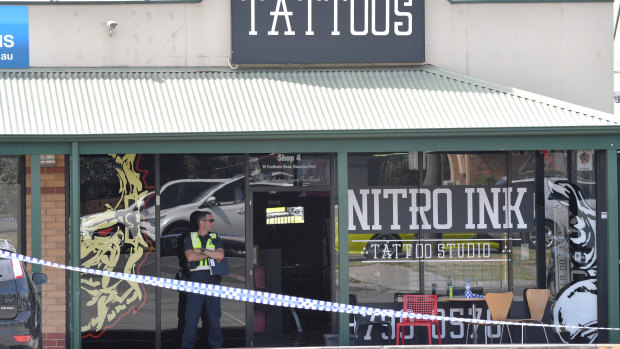 Police on the scene at the Nitro Ink tattoo parlour after Ale's shooting last year.