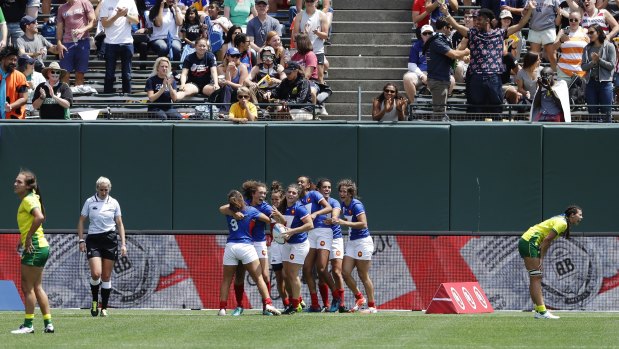 France celebrate after upsetting Australia 19-12 at the Rugby Sevens World Cup semifinal in San Francisco.