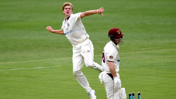 Will Sutherland of Victoria celebrates taking the wicket of Queensland's Jimmy Peirson during day two of their Shield clash at The Gabba.