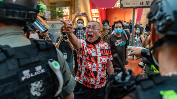 A pro-democracy supporter shouts at riot police during an anti-national security law rally in Mong Kok district on June 12. 