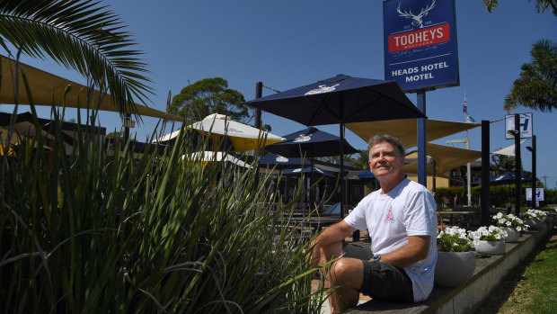 Retired schoolteacher, Gary Fletcher, 66, sits in front of the Heads Hotel in Shoalhaven, NSW.