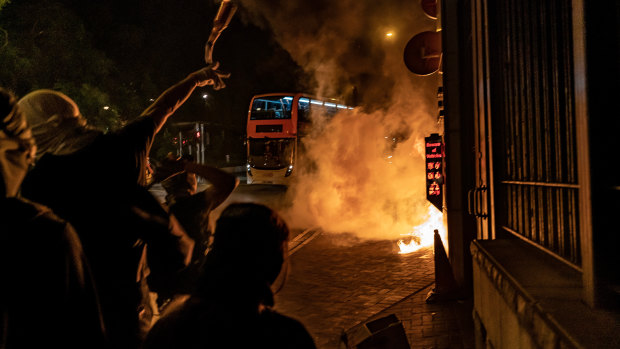 Pro-democracy protesters throw Molotov cocktails at a police station In Tuen Wan district in Hong Kong, China. 