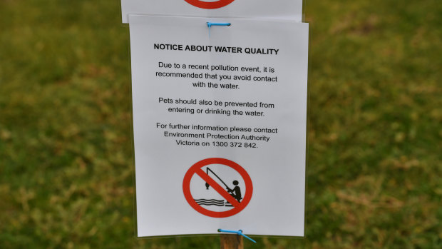 Melbourne Water employees put up warning signs at the Warmies around 5pm.