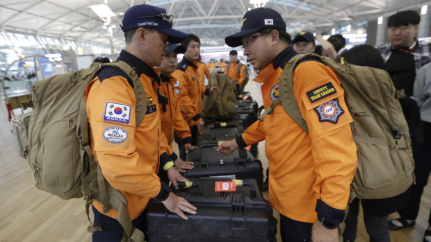 South Korean rescue team members prepare to board a plane to leave for Budapest at Incheon International Airport in Incheon, South Korea.