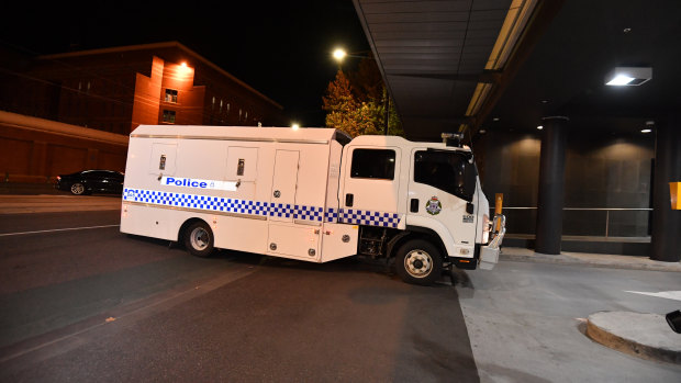 A Victoria Police prisoner transport truck believed to be carrying Ricardo Barbaro arrives at Melbourne West police station on Friday night.