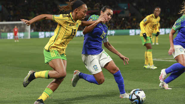 Brazil’s Marta, right, compete for controls the ball with Jamaica’s Tiernny Wiltshire during their 0-0 draw.