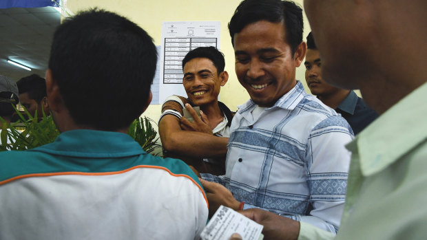 Cambodian voters queue at the Kandal Provincial Teacher Training School in Takhmao.