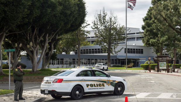 Police patrol the Fairview Development Centre in Costa Mesa, California, after if was announced it may be used to house coronavirus patients. 