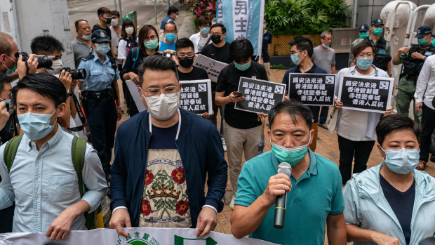 Pro-democracy lawmakers and activists rally against China's proposed security legislation on Friday. 