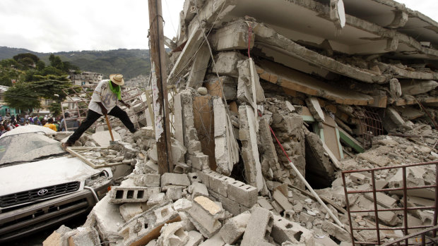 People work to free trapped victims after an earthquake in Port-au-Prince, Haiti, in 2010. 