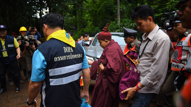 Kruba Boonchum, centre, is believed to be a reincarnation of the boy who loved the princess. 