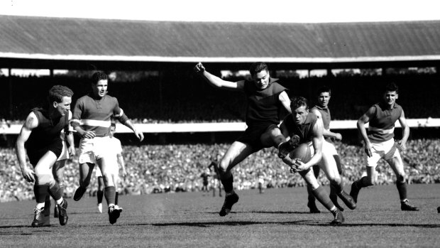 Footscray steal the ball from Barassi.
