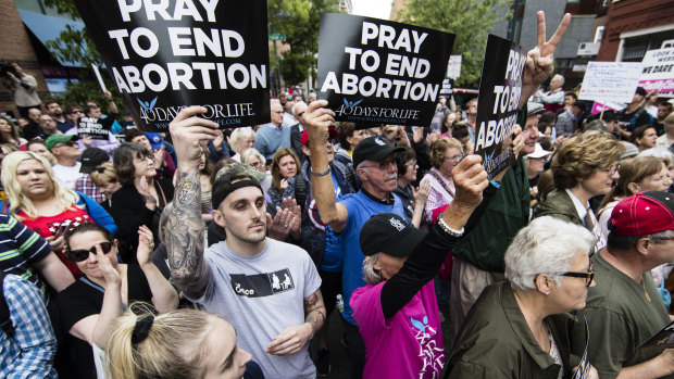 Anti-abortion protesters rally near a Planned Parenthood clinic in Philadelphia after a Democratic state lawmaker berated an anti-abortion demonstrator outside the clinic. 