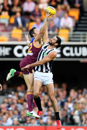 Tap out: Stefan Martin and Brodie Grundy fought a fierce battle in the ruck.