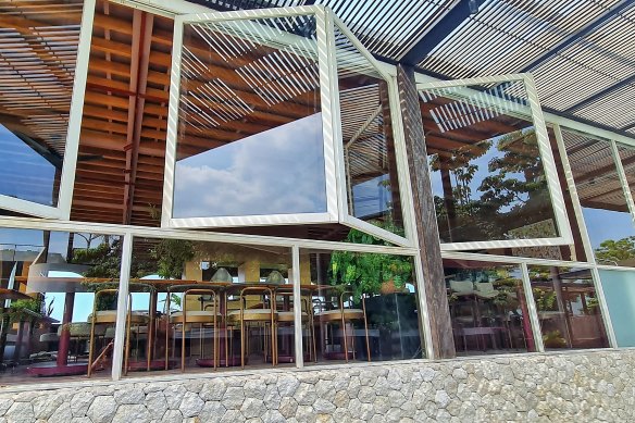 Empty chairs at empty tables. Tickled Pink Bali has been shuttered for weeks but furniture and fittings remain. 