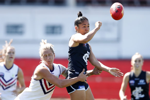 Guts and glory: The Blues’ Darcy Vescio is tackled by Janelle Cuthbertson of the Dockers at Ikon Park during round seven last month.