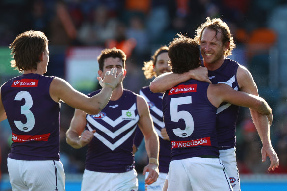 Fremantle, and veteran David Mundy, celebrate a goal.