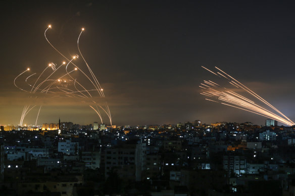Rockets are fired in both directions in the early hours of Friday as Israeli troops massed on the Gaza border. 