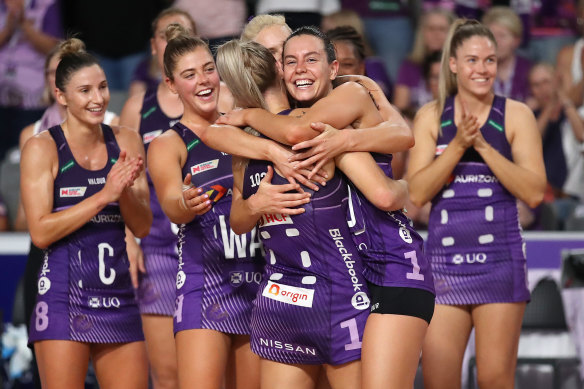 Ruby Bakewell-Doran (centre) is swamped by teammates after being named player of the match.