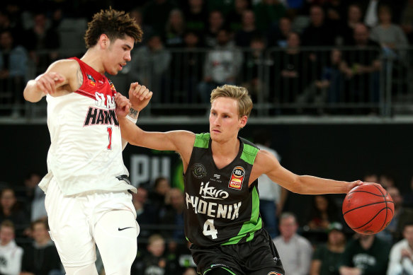 Kyle Adnam, pictured right playing against LaMelo Ball in the NBL, has been named in the Boomers squad for the opening Asia Cup qualifier. 