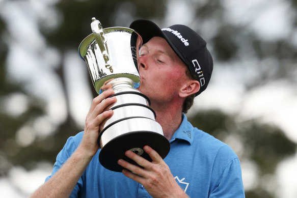 Ryggs Johnston gets acquainted with the Stonehaven Cup after his Australian Open win.