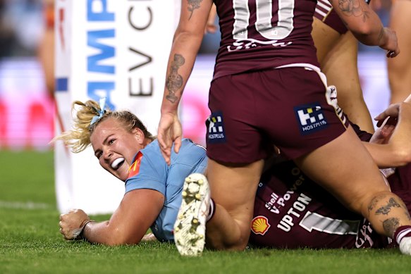 NSW prop Ellie Johnston crashes over to score.