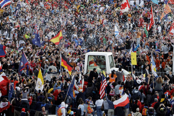 Up close and personal ... the crowds greeting Pope Benedict XVI at World Youth Day in Sydney in 2008.