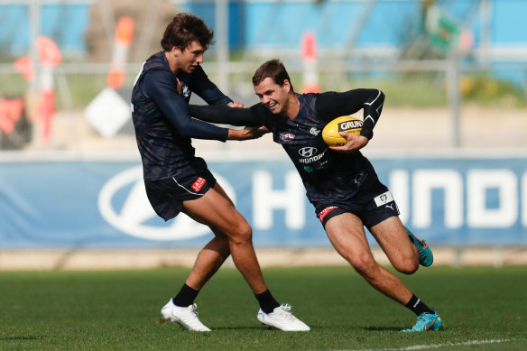 Carlton’s Brodie Kemp is tackled by teammate Caleb Marchbank (right) at training on Friday.