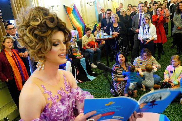 Drag queen Sam T reads book My Shadow is Pink by Scott Stuart during a drag story time event inside Parliament House on Wednesday morning.