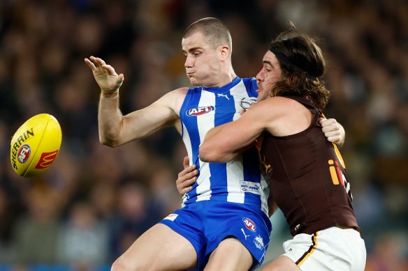 Roo Bailey Scott is tackled by Hawk Jai Newcombe.