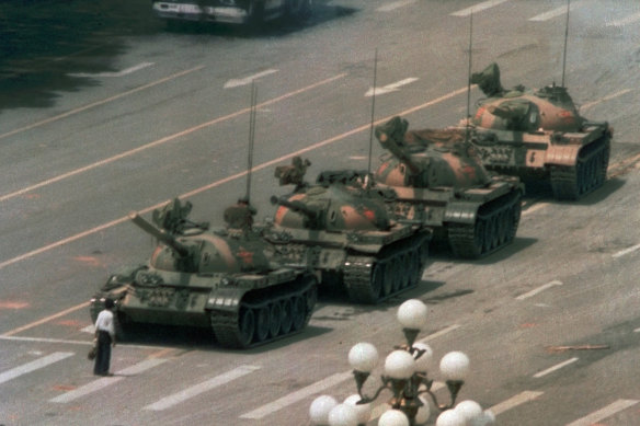 A Chinese man stands alone to block a line of tanks in Tiananmen Square in 1989.