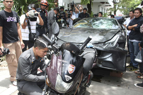 A Ferrari that was driven by Vorayuth Yoovidhya and a motorcycle, both involved in the accident, are displayed by police in Bangkok in 2012.