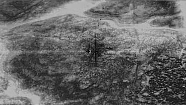 A remotely piloted aircraft focused on the compound of Islamic State leader Abu Bakr al-Baghdadi after the raid and moments before it was destroyed. Three munitions show as black at top centre of the image.