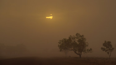 Hot and dry: a dust storm near Bourke on the evening of January 17. The region recorded Australia's highest minimum temperature, 36.6 degrees.