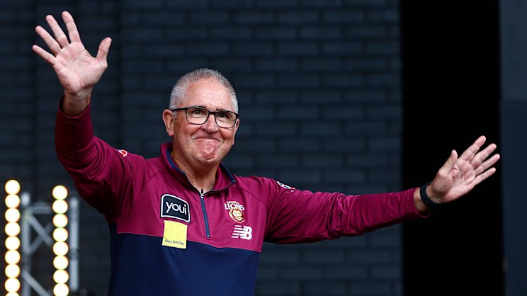 Chris Fagan posing with the AFL premiership cup