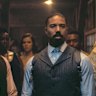 Michael B. Jordan and Michael B. Jordan (playing identical twins) and Omar Benson Miller in Sinners.