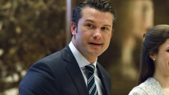 Pete Hegseth walks to an elevator for a meeting with President-elect Donald Trump at Trump Tower in 2016.