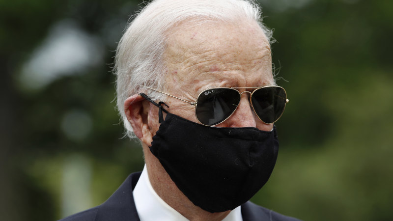 Joe Biden, wearing a mask, makes first campaign stop in months