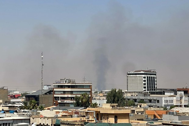 Black smoke rises following explosions near a military base hosting U.S. forces in the northern Iraqi city of Irbil. 
