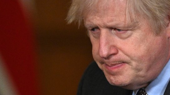 Britain’s Prime Minister Boris Johnson leaves the podium after leading a virtual press conference on the Covid-19 pandemic death toll. 